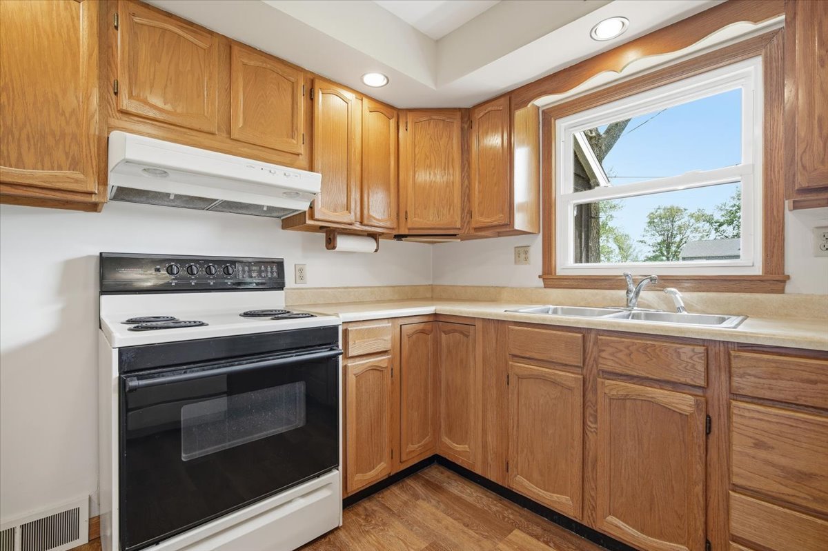 509 Smith Street Roanoke, IL 61561 - Photo 5 of 28 a kitchen with a stove and a sink
