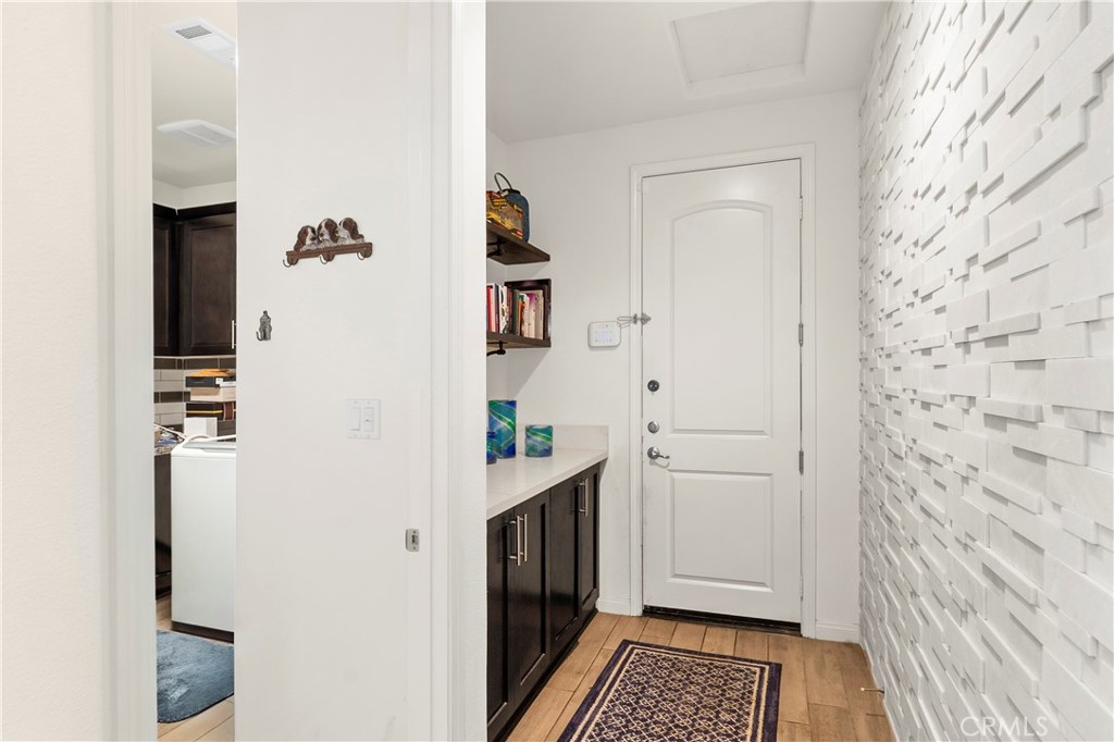 12528 Locke Circle Riverside, CA 92503 - Photo 11 of 46 a room with cabinets and wooden floor