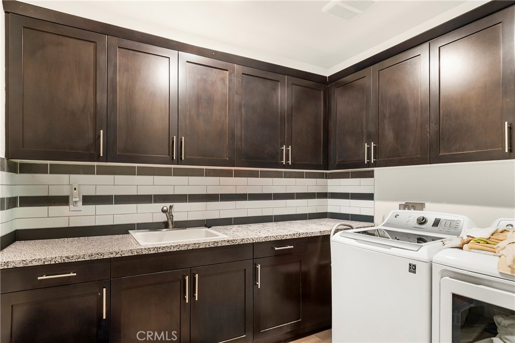 12528 Locke Circle Riverside, CA 92503 - Photo 12 of 46 a kitchen with a sink cabinets and appliances
