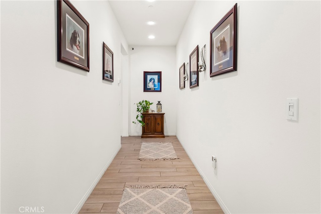 12528 Locke Circle Riverside, CA 92503 - Photo 13 of 46 a view of a hallway with wooden floor