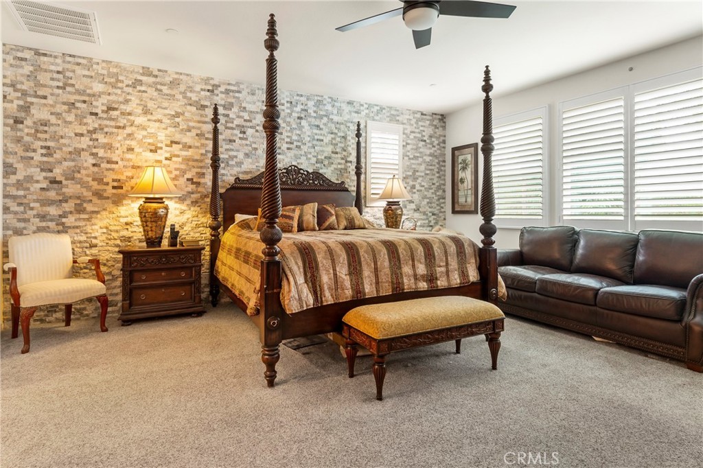 12528 Locke Circle Riverside, CA 92503 - Photo 14 of 46 a bedroom with furniture and a large window