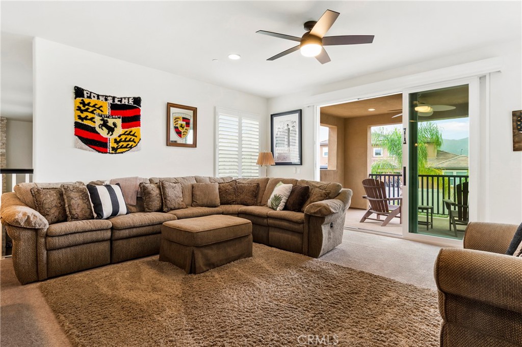 12528 Locke Circle Riverside, CA 92503 - Photo 21 of 46 a living room with furniture ceiling fan and a rug