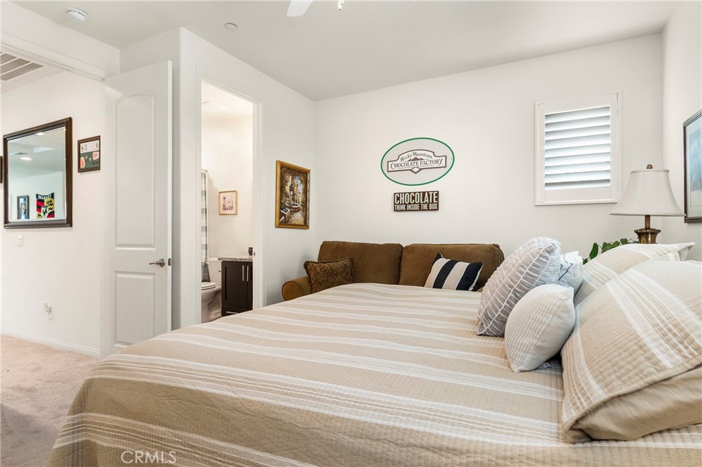 12528 Locke Circle Riverside, CA 92503 - Photo 29 of 46 a bedroom with a bed and a window