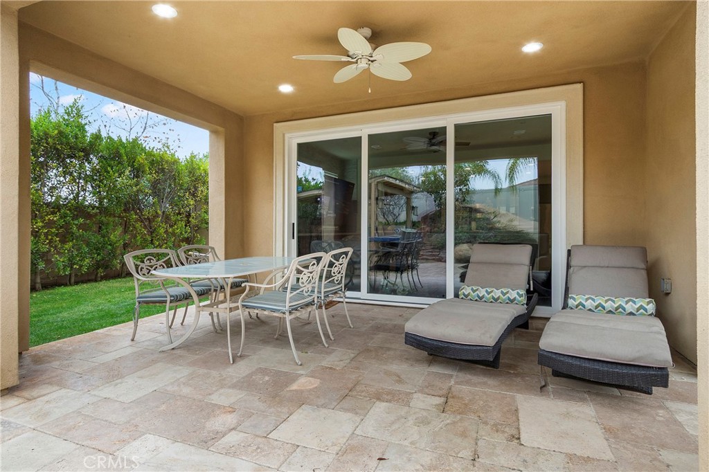 12528 Locke Circle Riverside, CA 92503 - Photo 34 of 46 a dining room with furniture and a floor to ceiling window