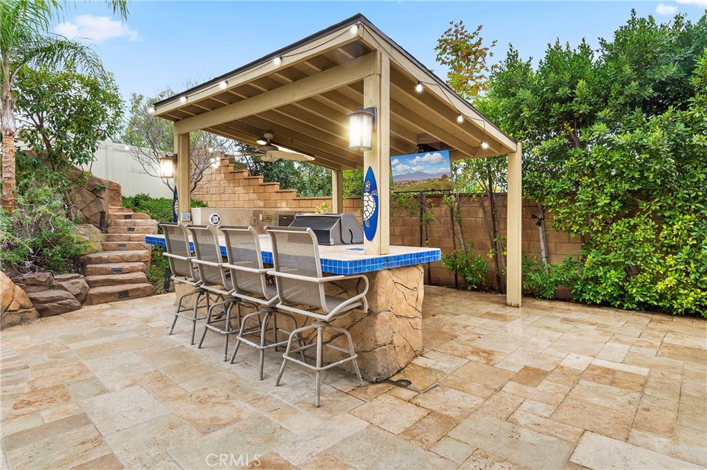 12528 Locke Circle Riverside, CA 92503 - Photo 38 of 46 a patio with table and chairs