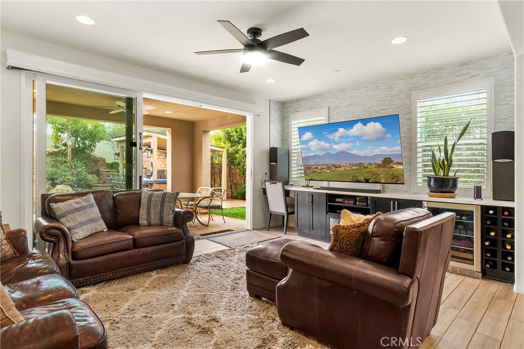 12528 Locke Circle Riverside, CA 92503 - Photo 4 of 46 a living room with furniture ceiling fan and a large window