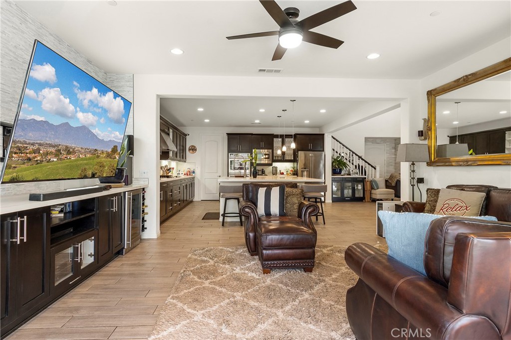 12528 Locke Circle Riverside, CA 92503 - Photo 5 of 46 a living room with furniture and a flat screen tv