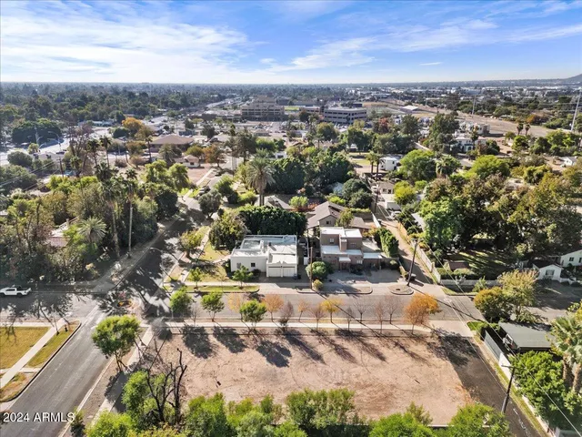 a view of dirt field with trees