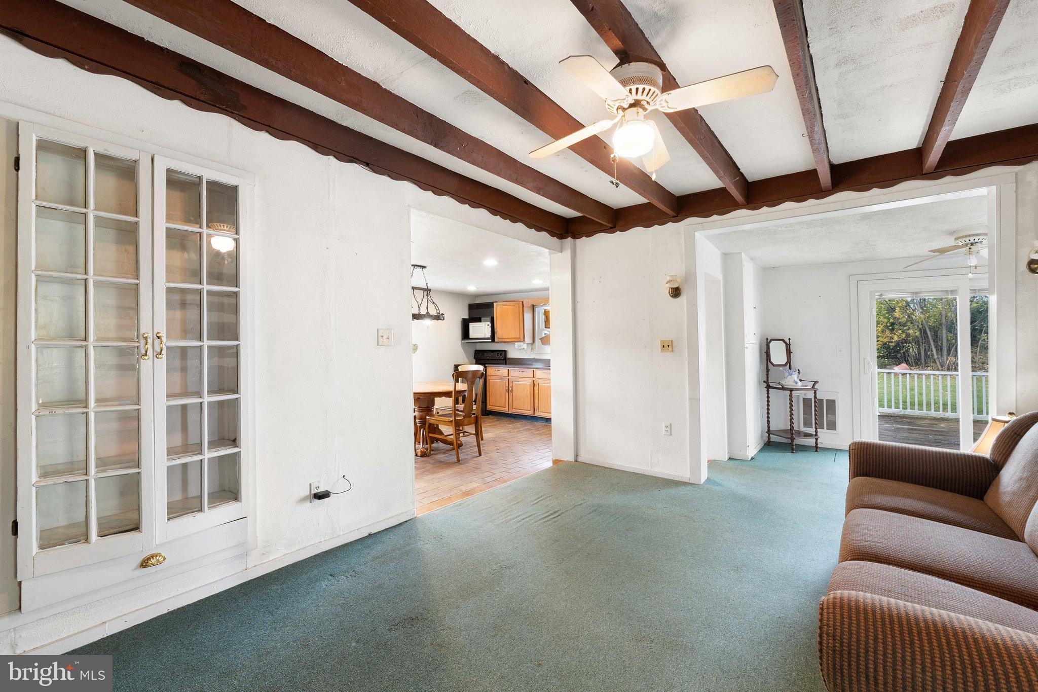210 Clark Road Middletown, VA 22645 - Photo 12 of 38 Den off of kitchen with exposed beams