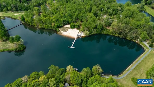 an aerial view of a house with a lake view