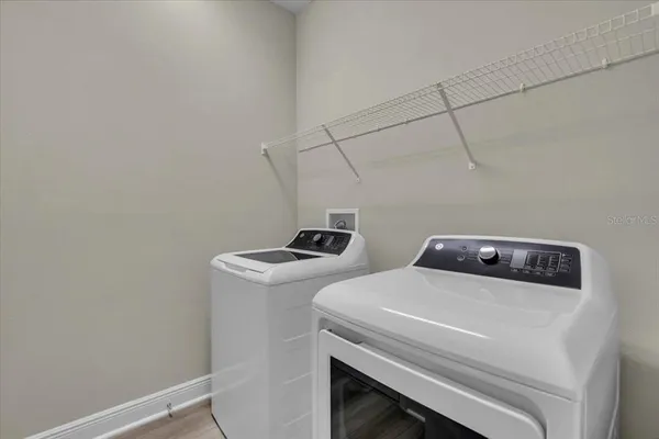 a utility room with dryer and washer
