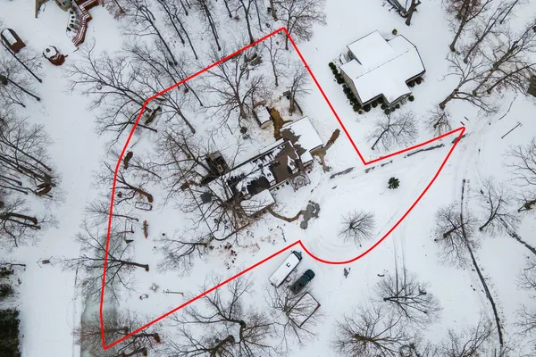 a view of a backyard of snow