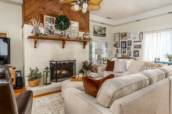 a living room with furniture and a large window