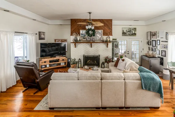 a living room with furniture and a flat screen tv