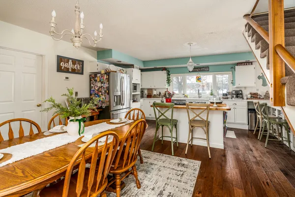 a kitchen with stainless steel appliances a stove refrigerator sink and cabinets