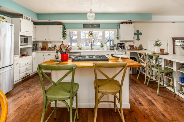 a open kitchen with stainless steel appliances granite countertop a stove and cabinets