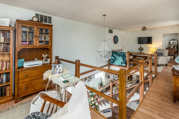 a bedroom with a bed and a flat tv screen