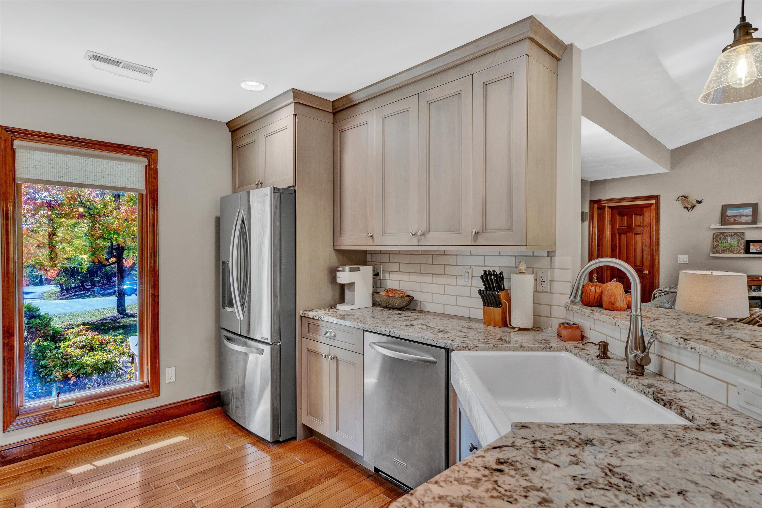 526 Stonebridge Drive Blue Ridge, VA 24064 - Photo 11 of 35 a kitchen with stainless steel appliances granite countertop a refrigerator sink and stove