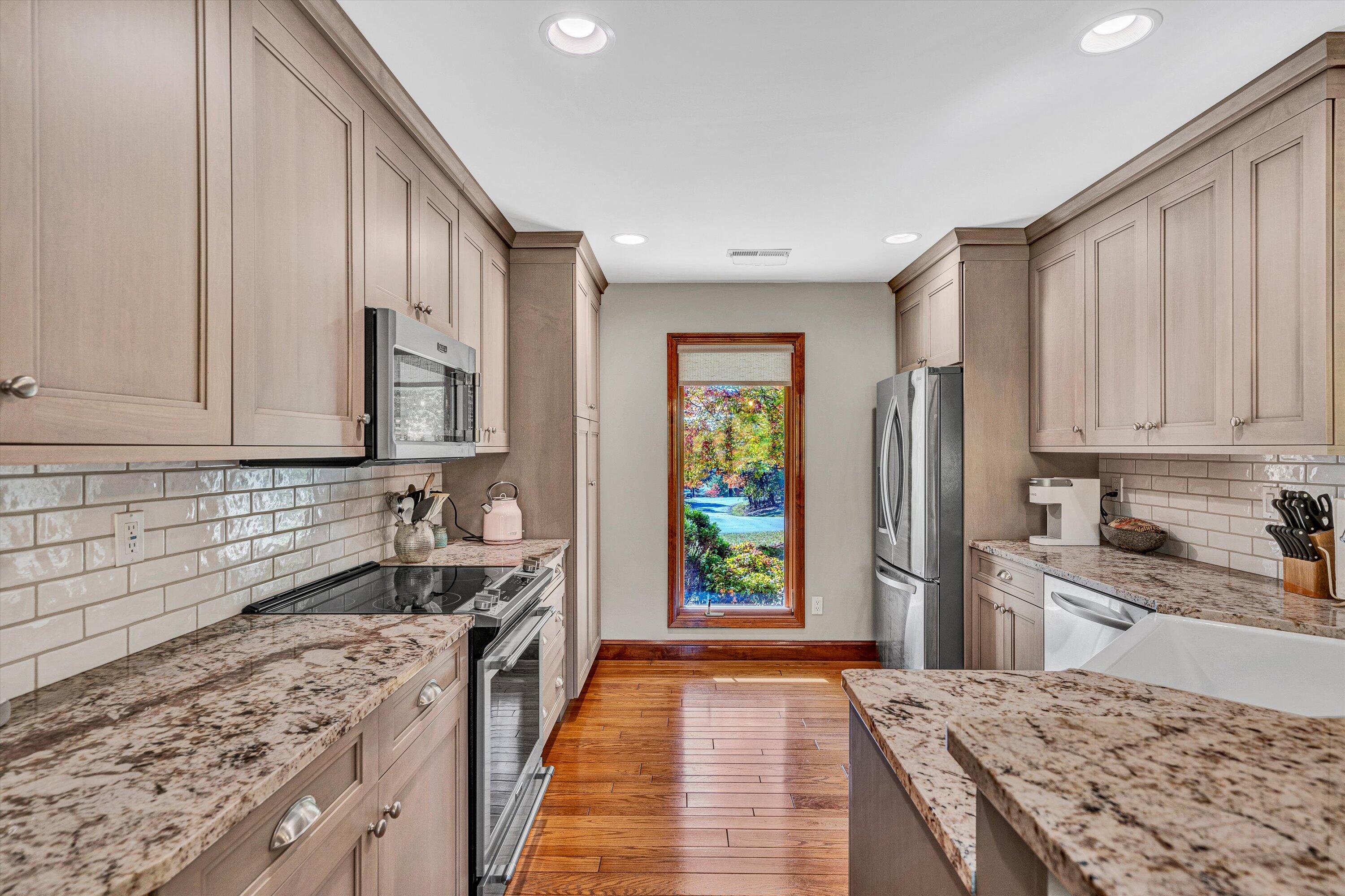 526 Stonebridge Drive Blue Ridge, VA 24064 - Photo 8 of 35 a kitchen with stainless steel appliances granite countertop a stove a sink and a refrigerator