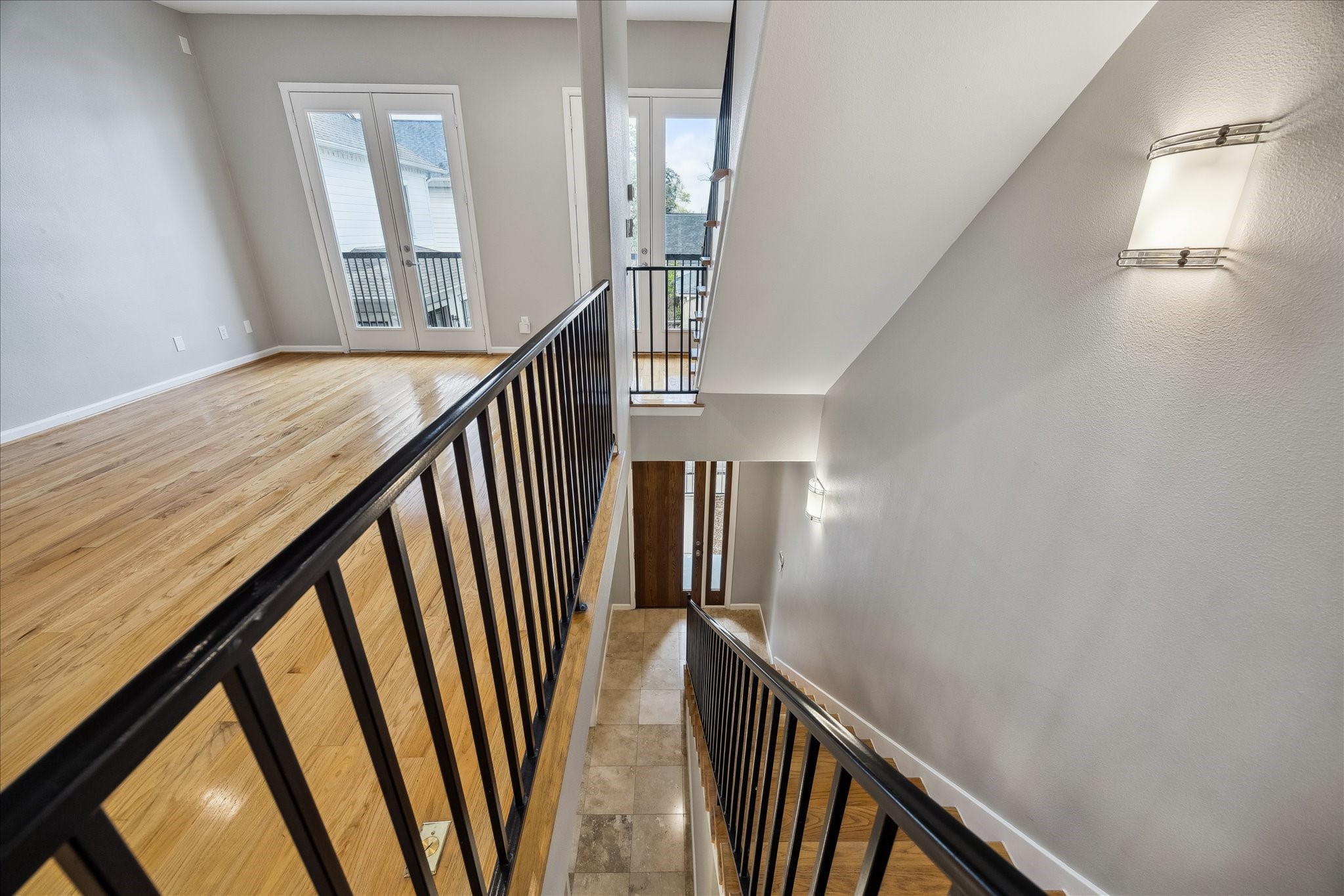 802 Waverly Street, Unit D Houston, TX 77007 - Photo 17 of 30 a view of staircase with railing and white walls