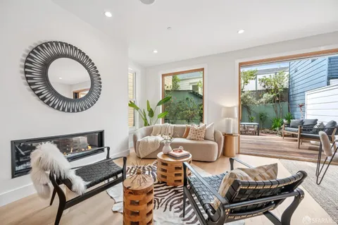 a view of a patio with table and chairs and potted plants