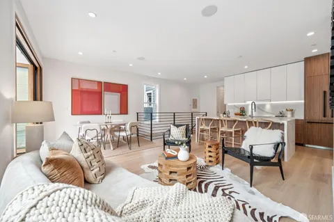 a view of a patio with table and chairs and potted plants
