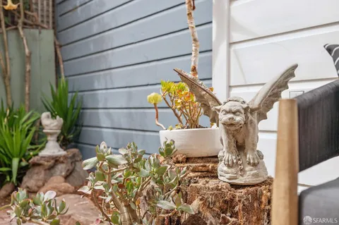 a bathroom with double vanity and a mirror