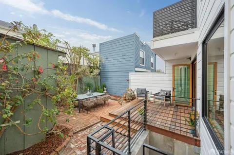 a spacious bathroom with a glass shower door and a mirror