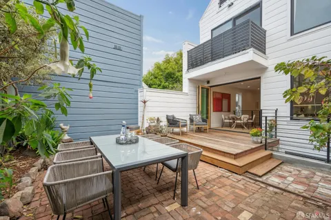 a spacious bedroom with a bed and a window