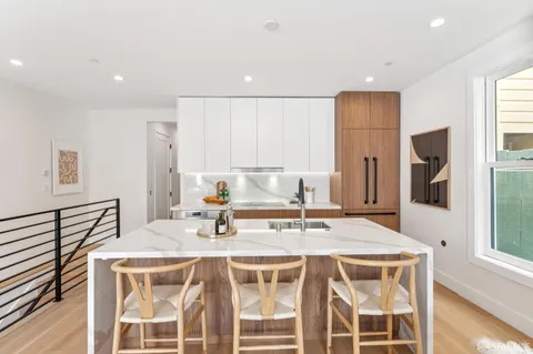 a bathroom with a granite countertop sink mirror and double