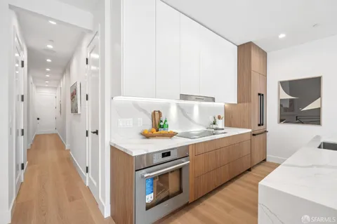a view of living room with furniture and large window