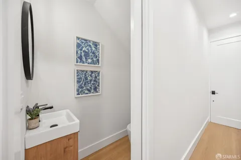 a bedroom with a bed a table and chair