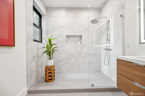 a view of a storage and utility room with sink washer and dryer