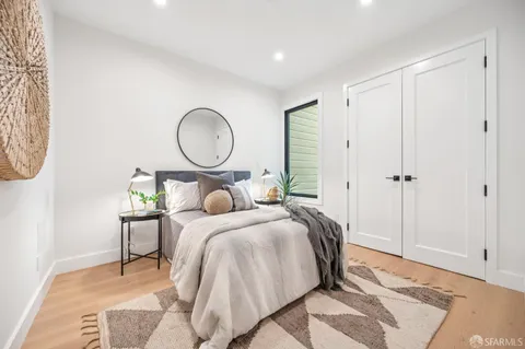 a view of swimming pool with a bench in front of main door