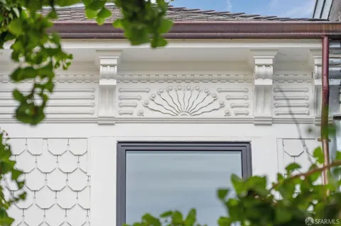 a bathroom with shower and mirror