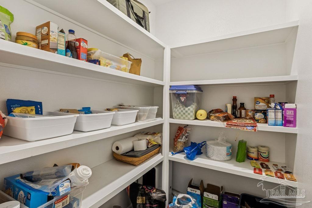 1555 Cadence Loop Cantonment, FL 32533 - Photo 12 of 34 a kitchen with a refrigerator and a sink