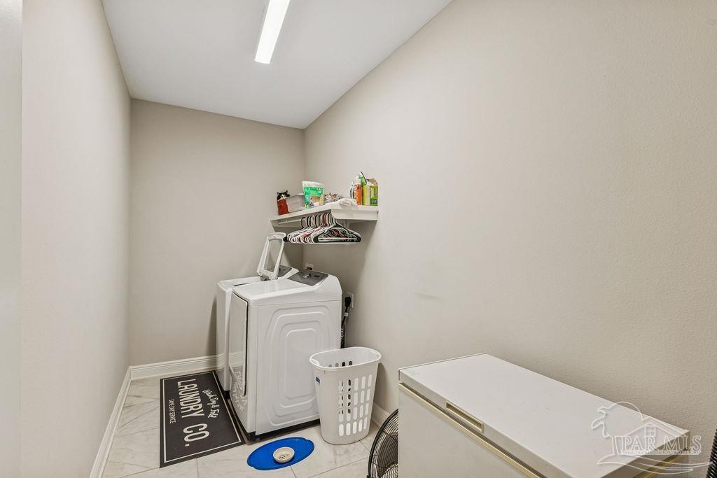 1555 Cadence Loop Cantonment, FL 32533 - Photo 20 of 34 a utility room with dryer and washer