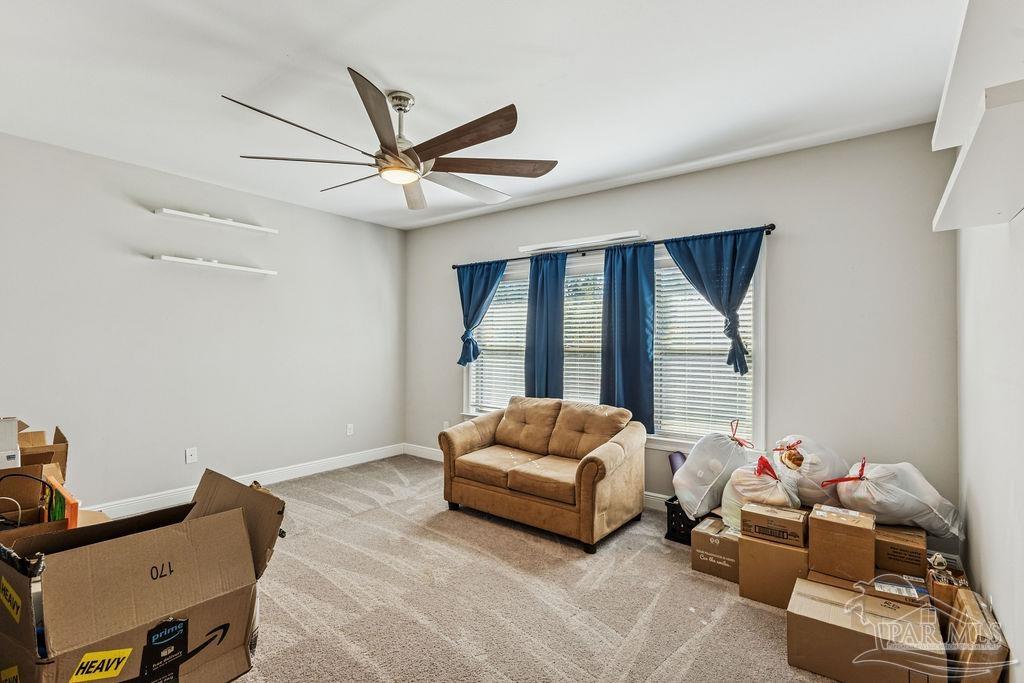 1555 Cadence Loop Cantonment, FL 32533 - Photo 30 of 34 a living room with furniture and a window