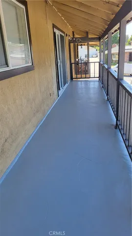 a view of a hallway with windows