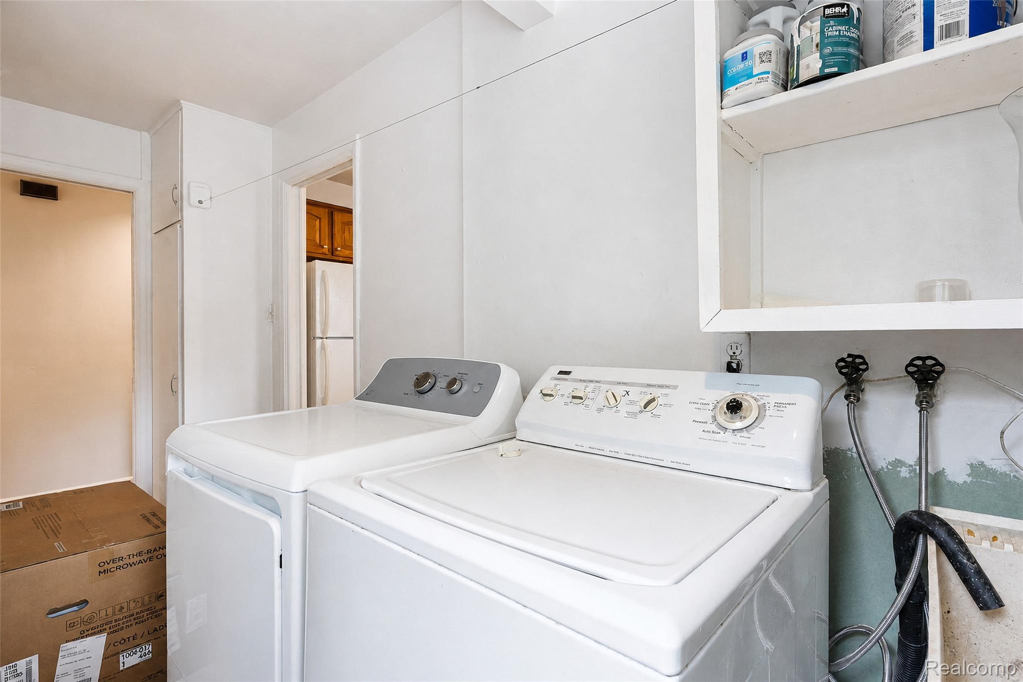 1846 Pembroke Road Birmingham, MI 48009 - Photo 28 of 37 Built-in upper shelving, built-in storage cabinet, and a utility sink