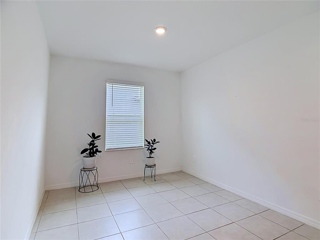 1633 Red Loop Lakeland, FL 33801 - Photo 19 of 60 a view of an empty room with a window