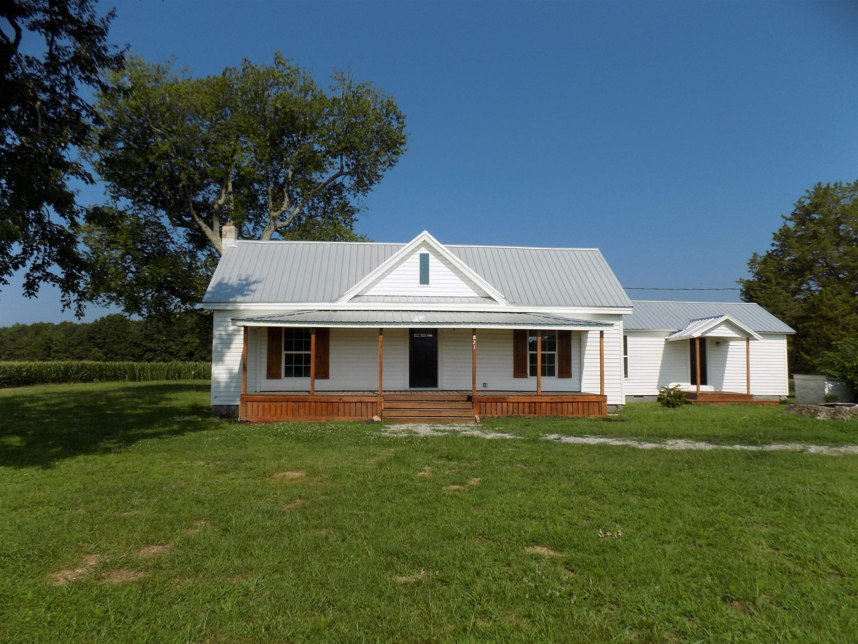 821 Greys Mill Road Louisburg, NC 27549 - Photo 1 of 33 a front view of a house with a garden