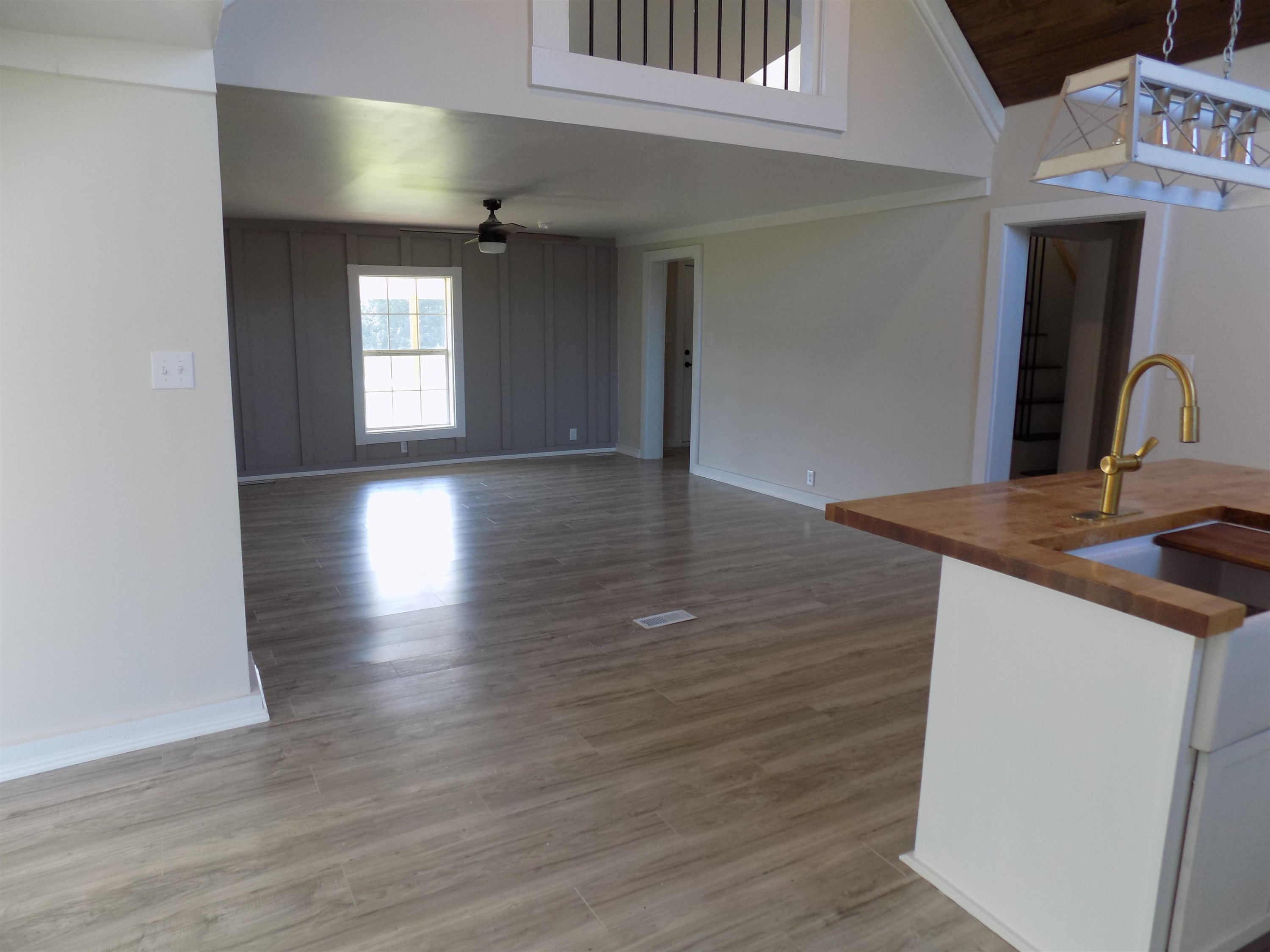 821 Greys Mill Road Louisburg, NC 27549 - Photo 12 of 33 a view of a kitchen from the hallway with a window