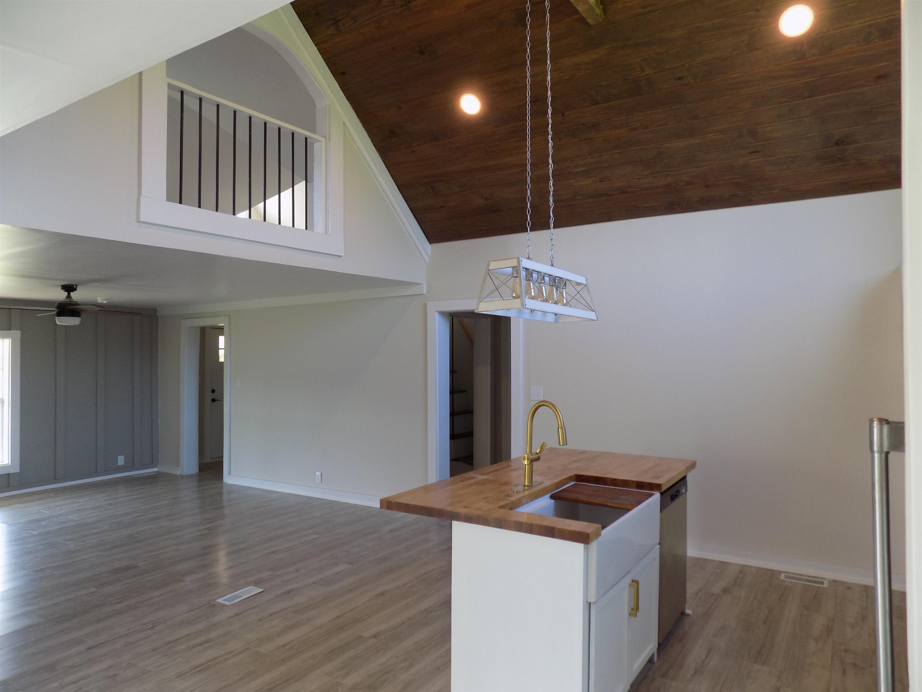 821 Greys Mill Road Louisburg, NC 27549 - Photo 13 of 33 a kitchen with a stove and a wooden floor