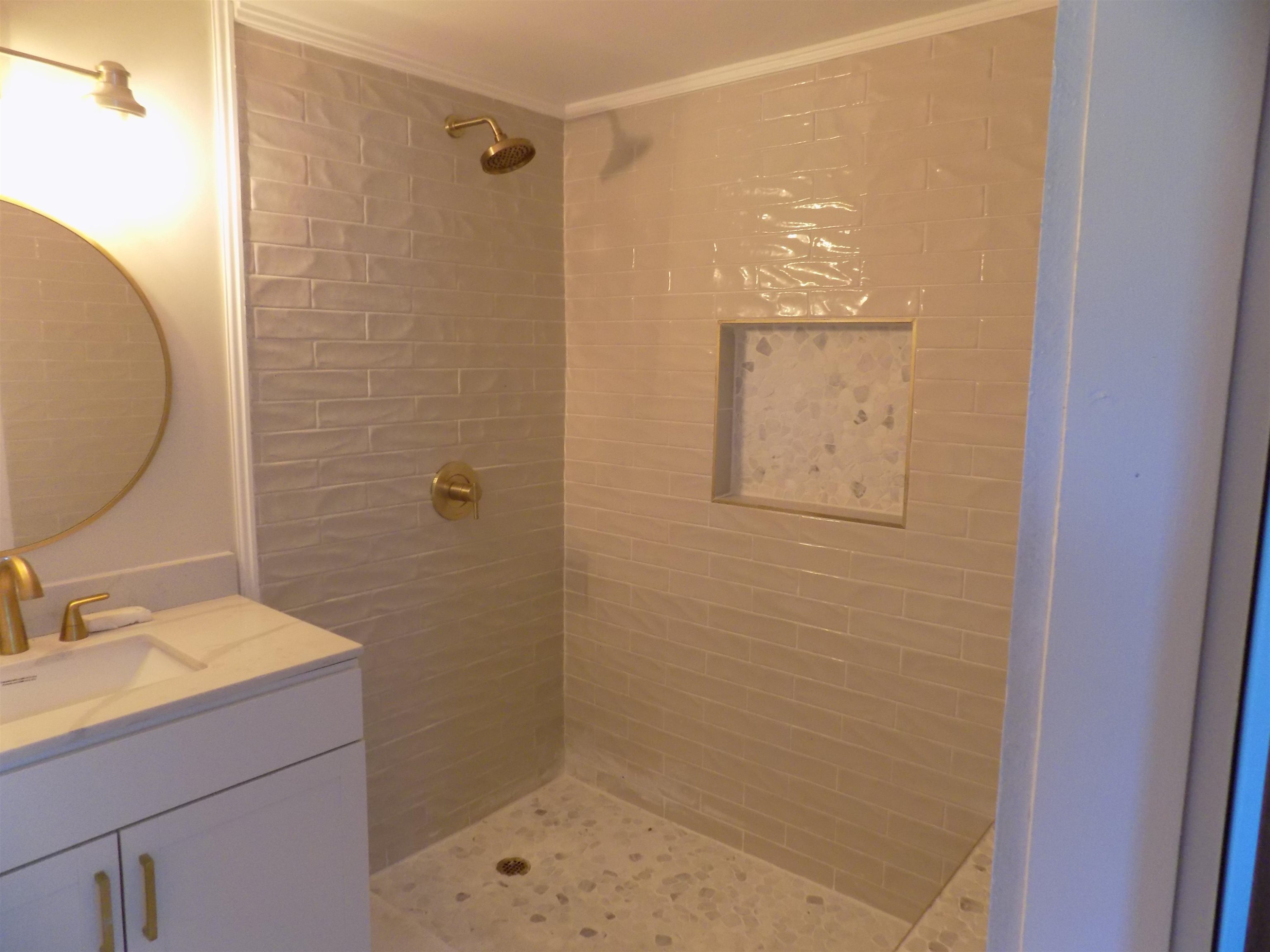 821 Greys Mill Road Louisburg, NC 27549 - Photo 19 of 33 a bathroom with a sink a toilet and shower