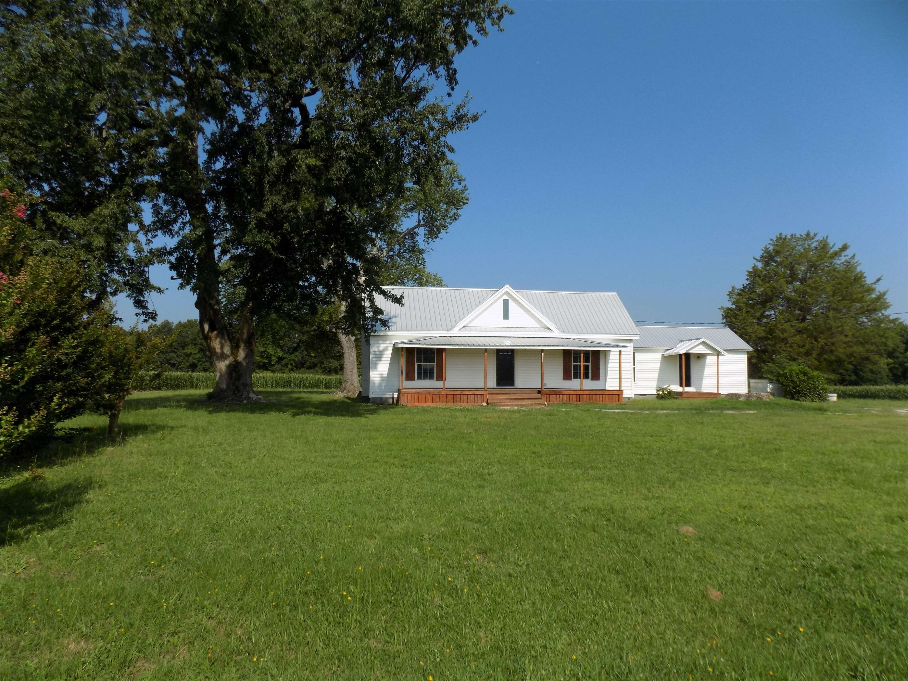 821 Greys Mill Road Louisburg, NC 27549 - Photo 2 of 33 a front view of a house with a garden