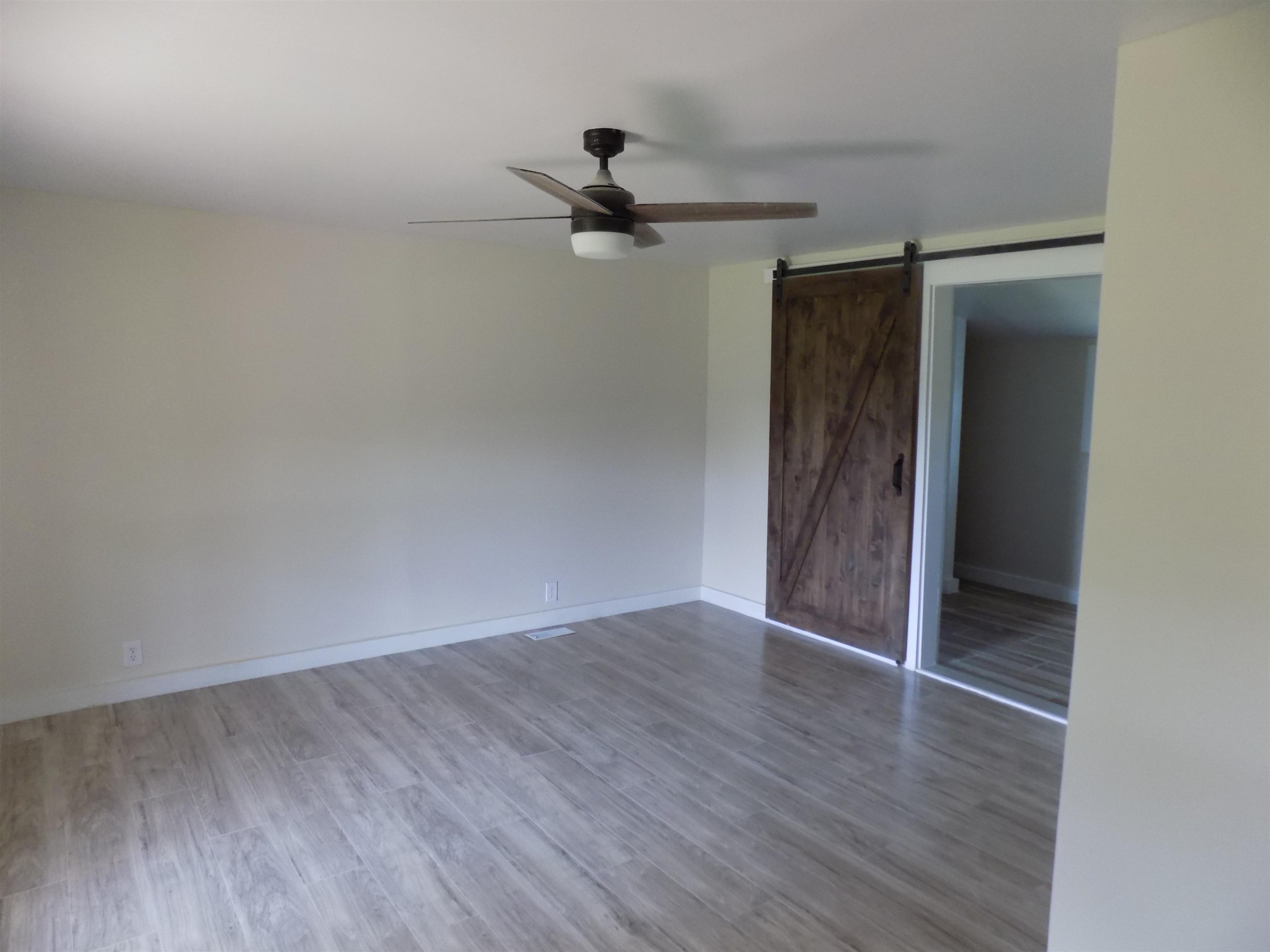 821 Greys Mill Road Louisburg, NC 27549 - Photo 22 of 33 wooden floor in an empty room
