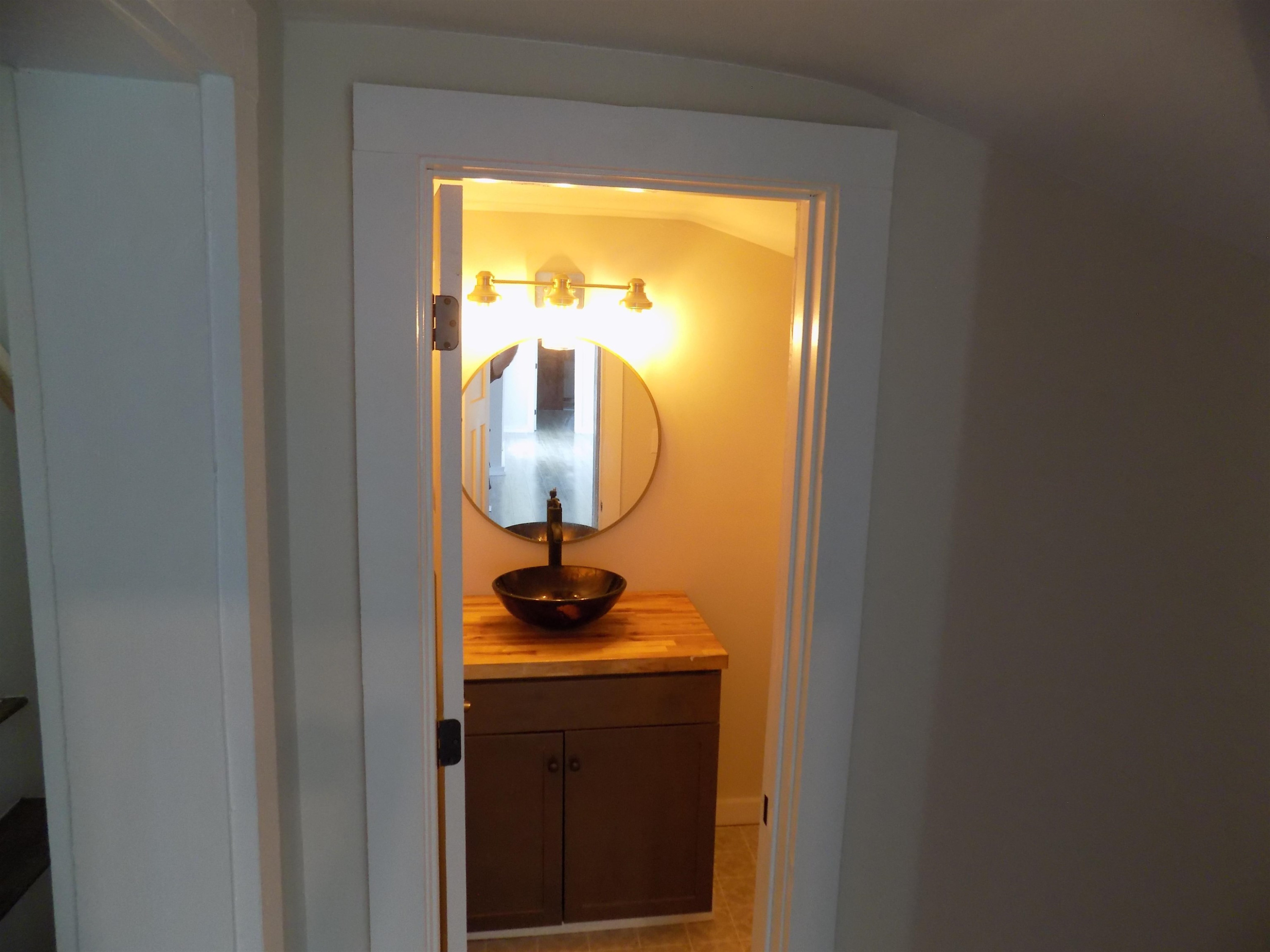 821 Greys Mill Road Louisburg, NC 27549 - Photo 28 of 33 a bathroom with a sink and a mirror