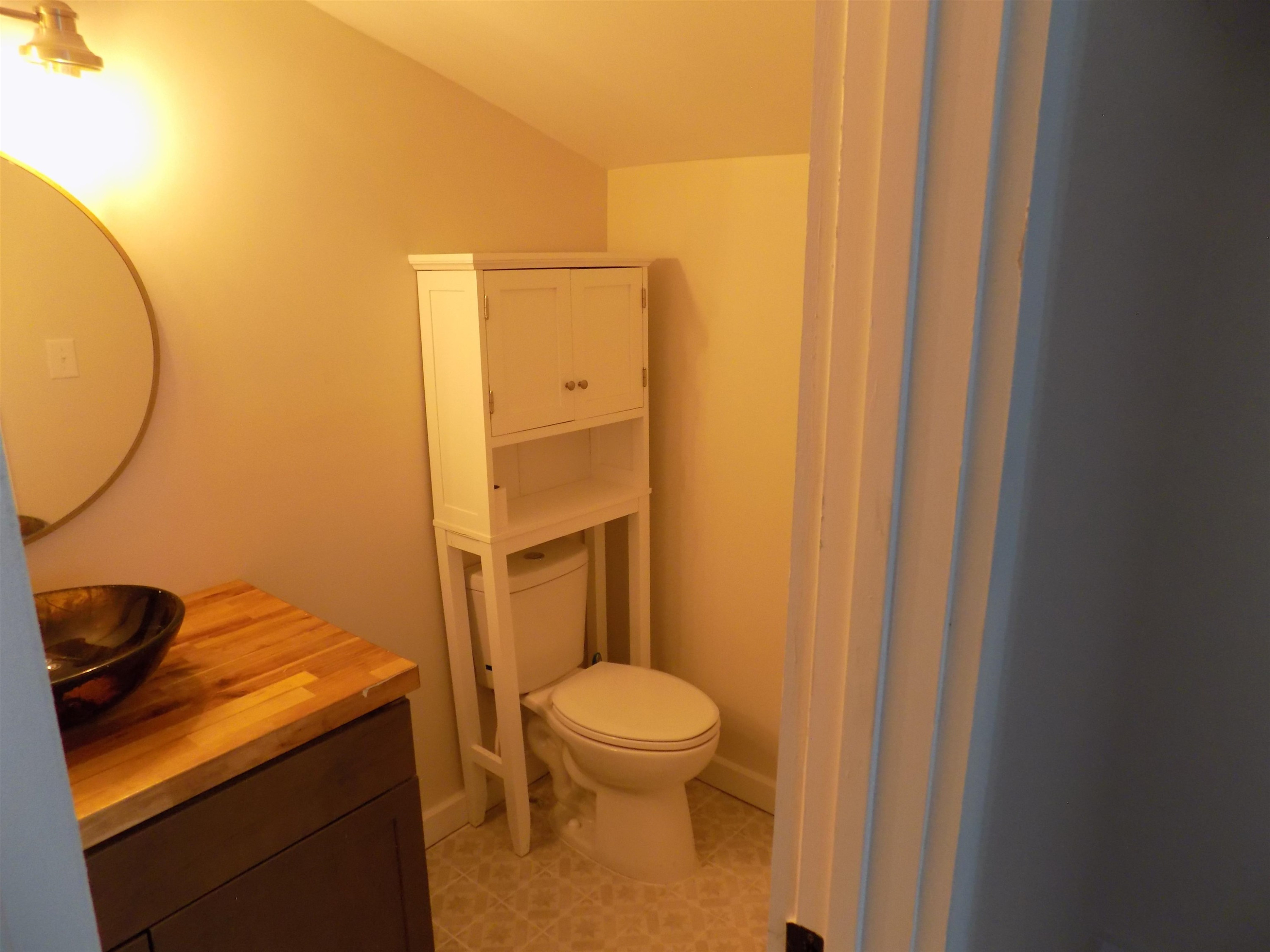 821 Greys Mill Road Louisburg, NC 27549 - Photo 29 of 33 a bathroom with a granite countertop sink and a mirror