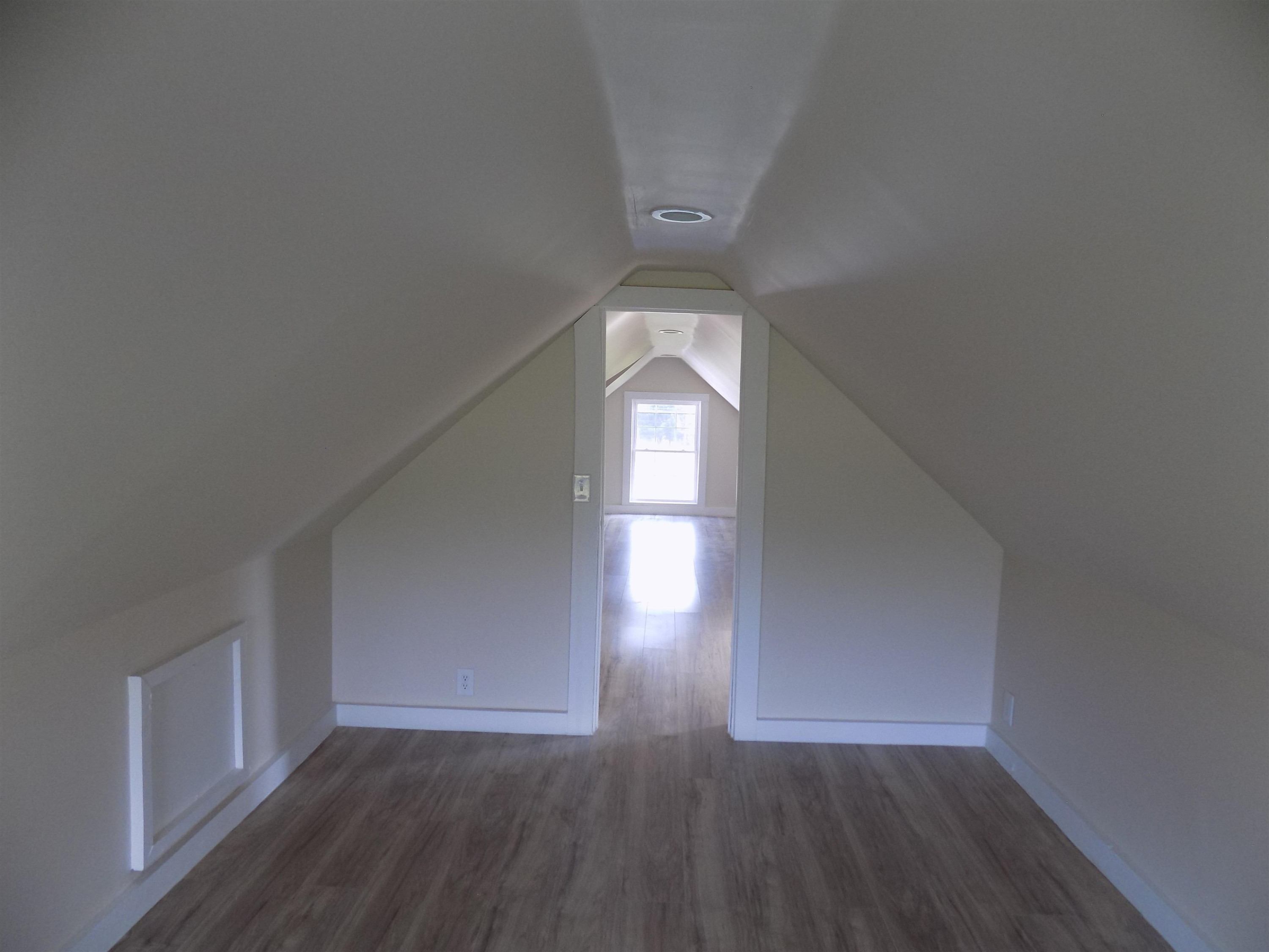 821 Greys Mill Road Louisburg, NC 27549 - Photo 33 of 33 wooden floor in an empty room with a window